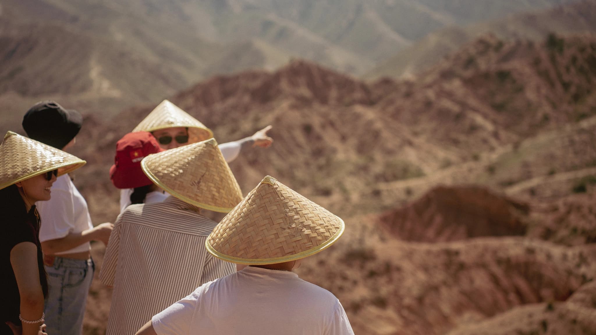 Eagle hunter with golden eagle against mountain backdrop