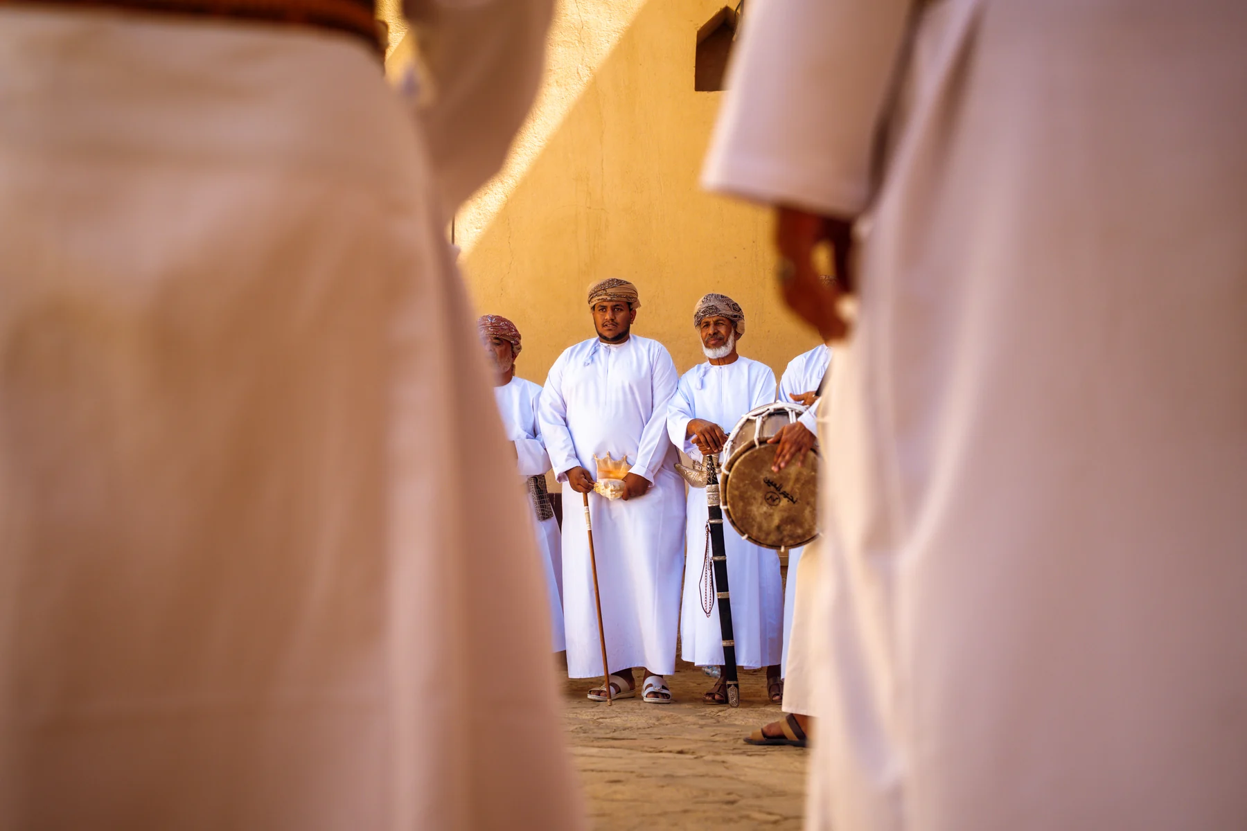 Warm stone architecture and shadows at Nizwa Fort