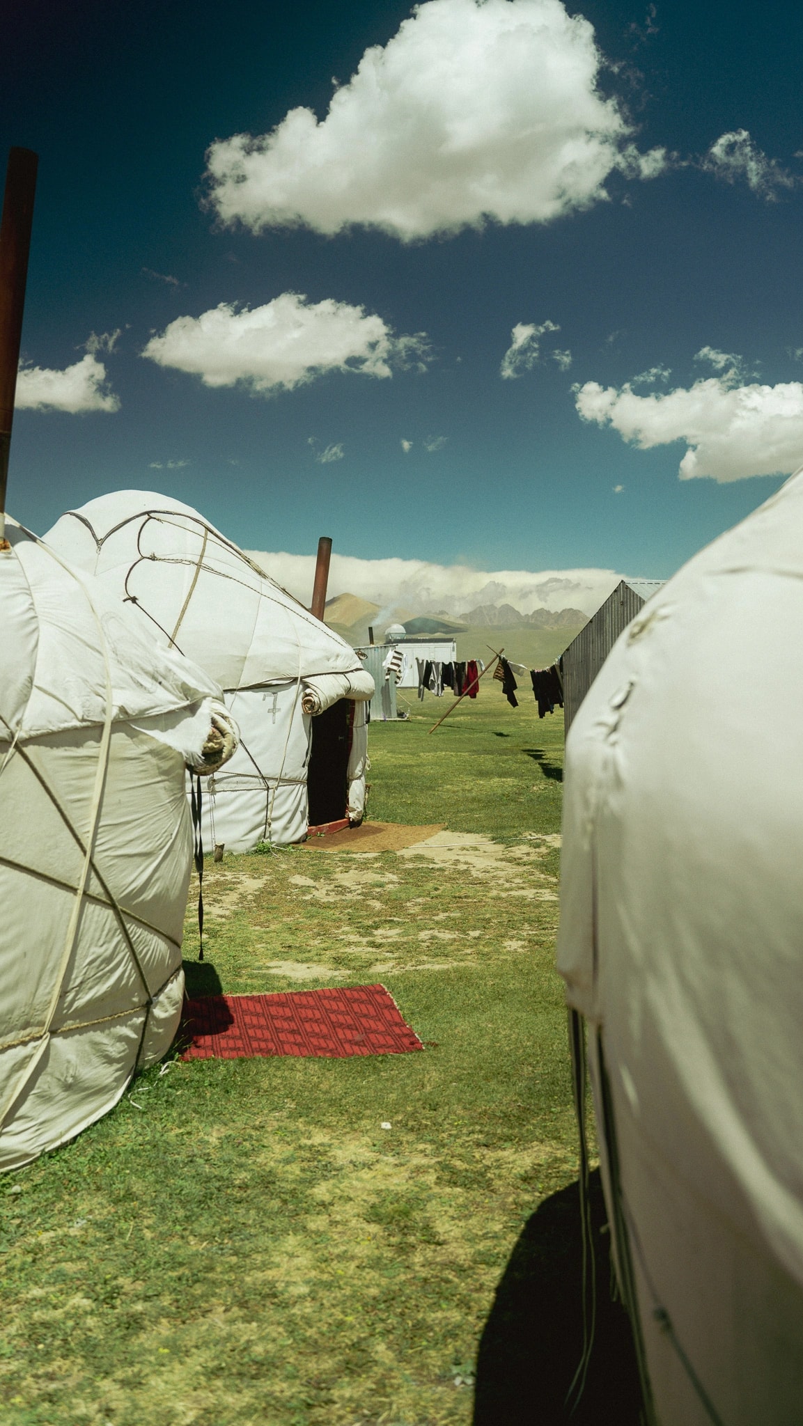 Traditional nomadic yurt against mountain landscape