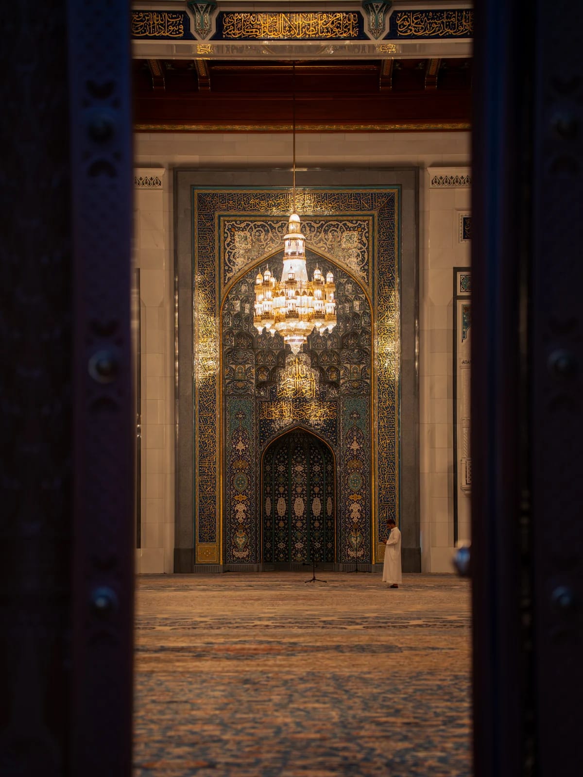 Mosque view framed through an ornate doorway