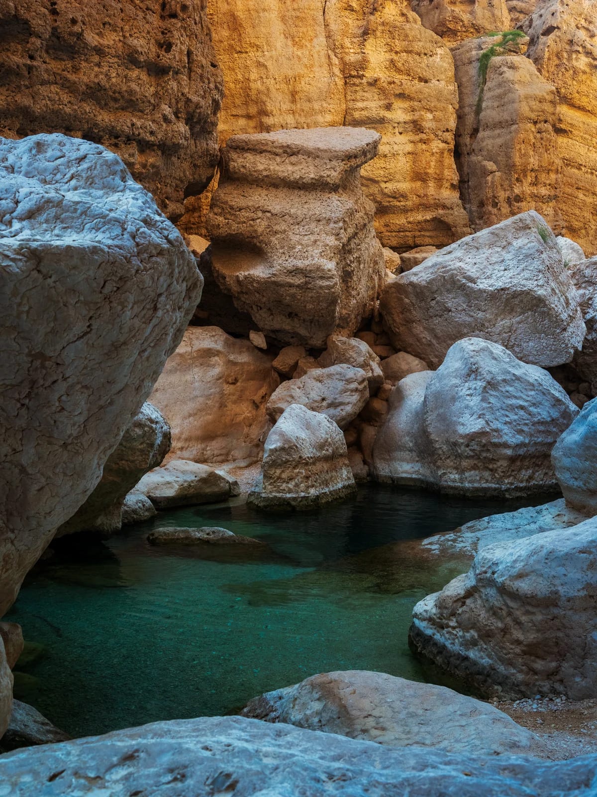 Deep turquoise water in Wadi Shab canyon
